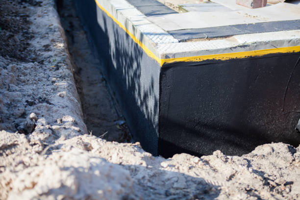 Professional Waterproofing technician working in Yoder, IN
